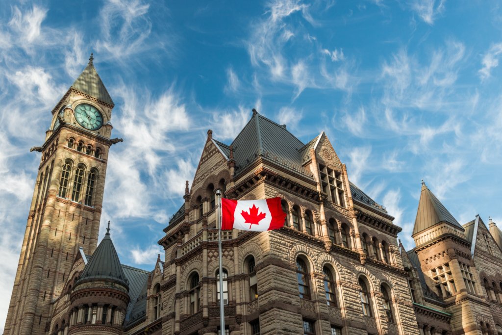 The,Canadian,Flag,Flies,Before,The,Old,City,Hall,In